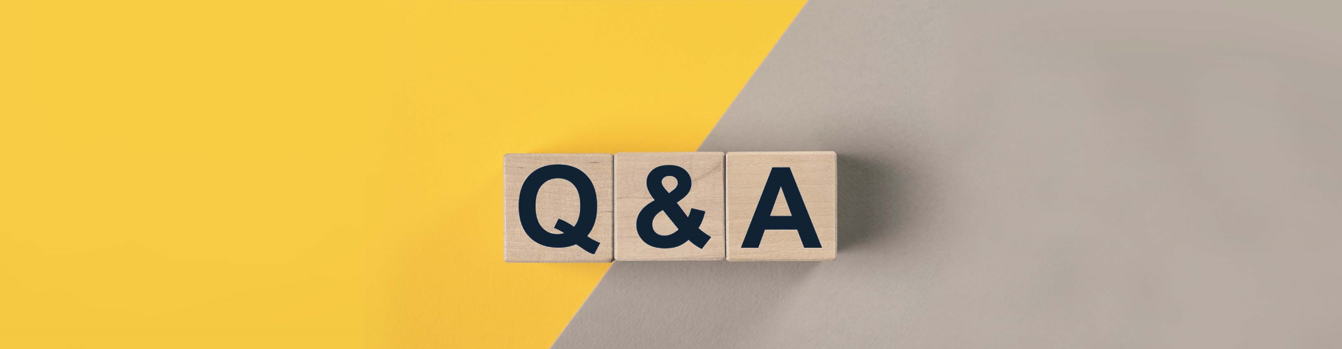 qa-or-q-concept-qna-acronym-on-wooden-cubes-on-gray-and-yellow-surface-with-copy-space